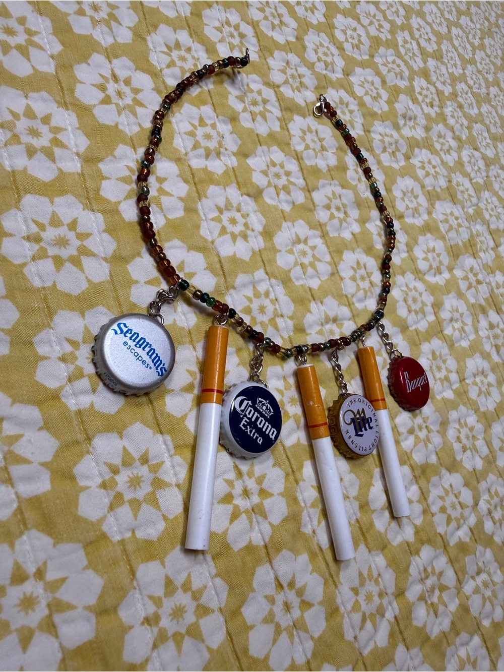 Beaded Necklace with Bottle Cap Charms and Cigarette Pendants